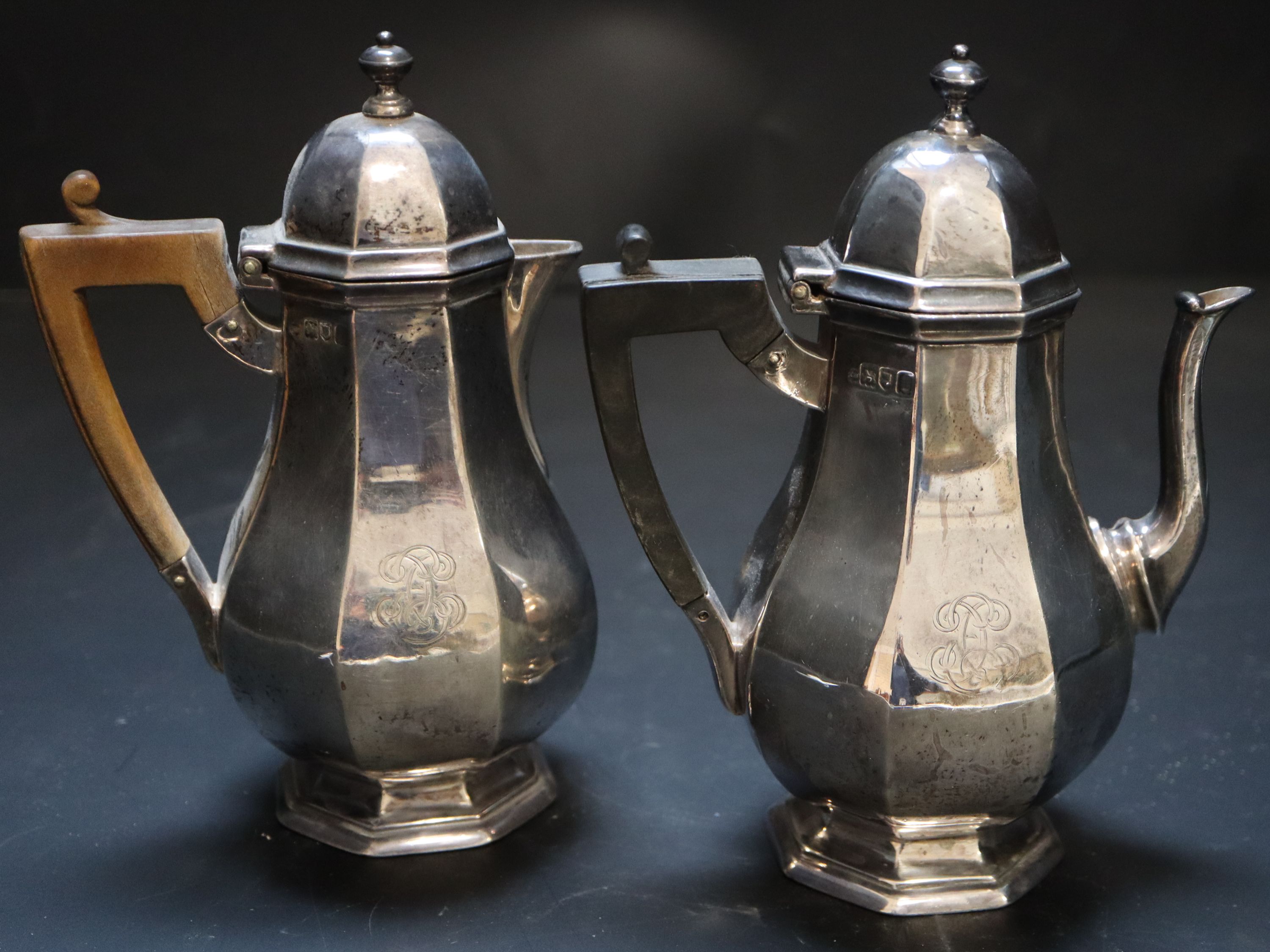 A pair of Edwardian silver café-au-lait pots, octagonal baluster bodies, monogrammed, Thomas Bradbury, London 1904
